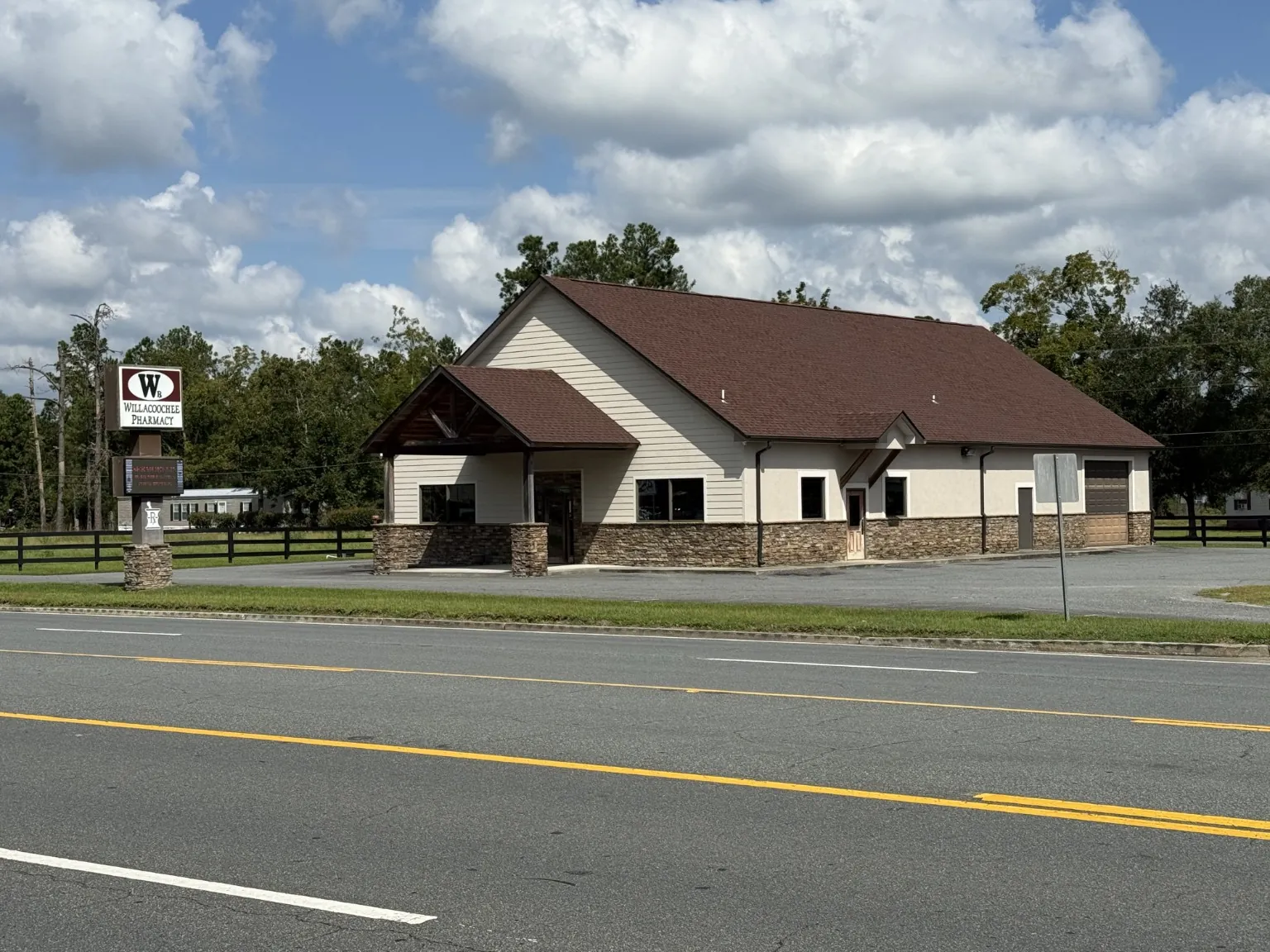 Willacoochee Pharmacy storefront with its roadside sign